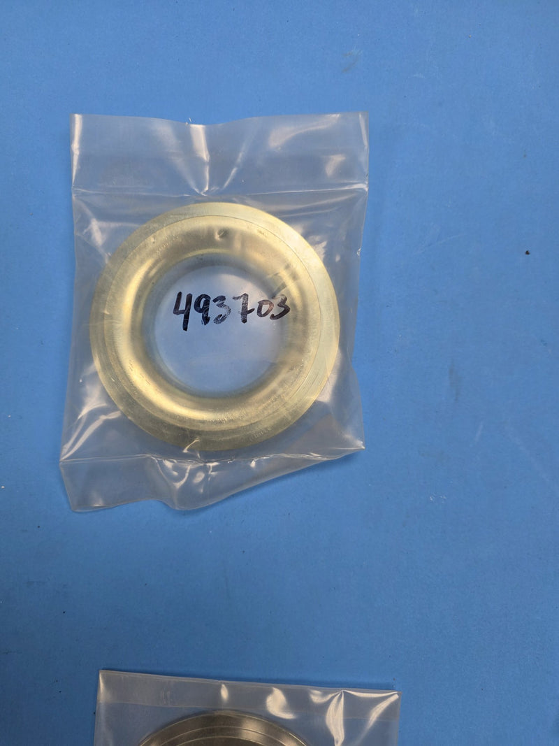Hand written 493703 bag holding a machined brass coloured ring on the Prince George BC shelf