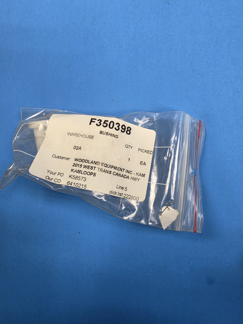 White nylon bushing in a bag labelled F350398 BUSHING at AIM Rentals Prince George