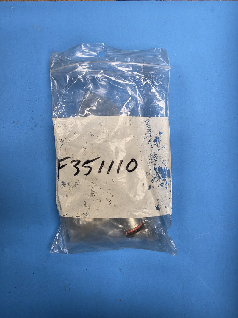 Bag hand marked F351110 holding a brass hydraulic fitting at AIM Rentals Prince George