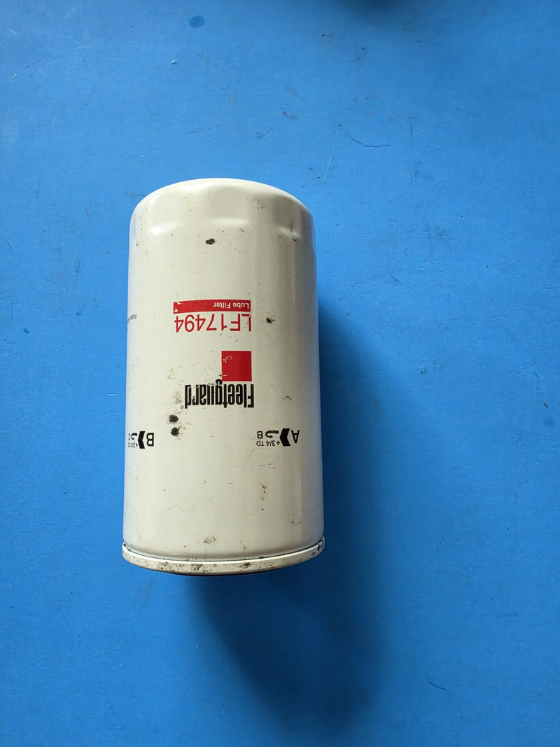 Genuine Fleetguard LF17494 lube filter, tall unwrapped can with the plus three quarter turn torque marks printed on the side, photographed in Prince George BC
