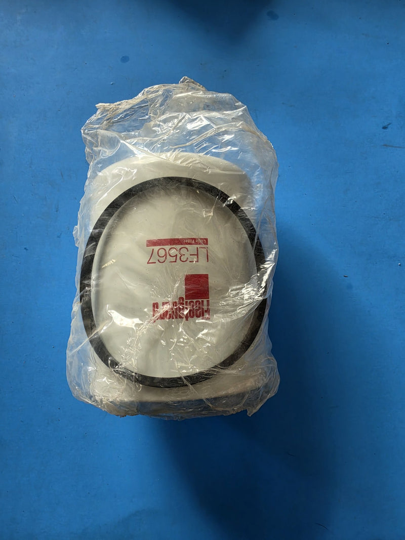 Genuine Fleetguard LF3567 lube filter in its factory bag, photographed base end up so the large sealing gasket is visible, in Prince George BC