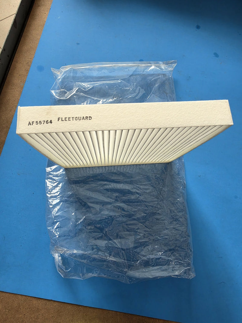 Genuine Fleetguard AF55764 cabin air panel filter out of its poly bag on the bench, AF55764 FLEETGUARD stamped into the frame, photographed in Prince George BC