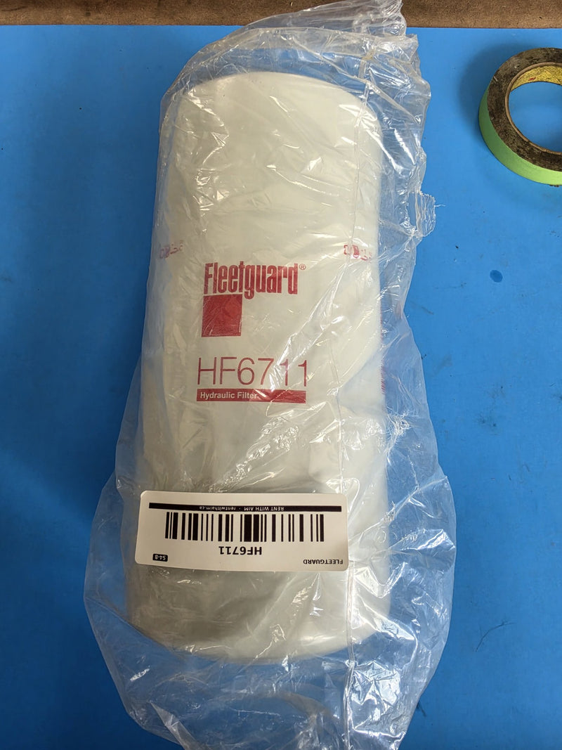 Genuine Fleetguard HF6711 hydraulic filter, tall white spin on can in its factory bag on rack S4-B, photographed in Prince George BC