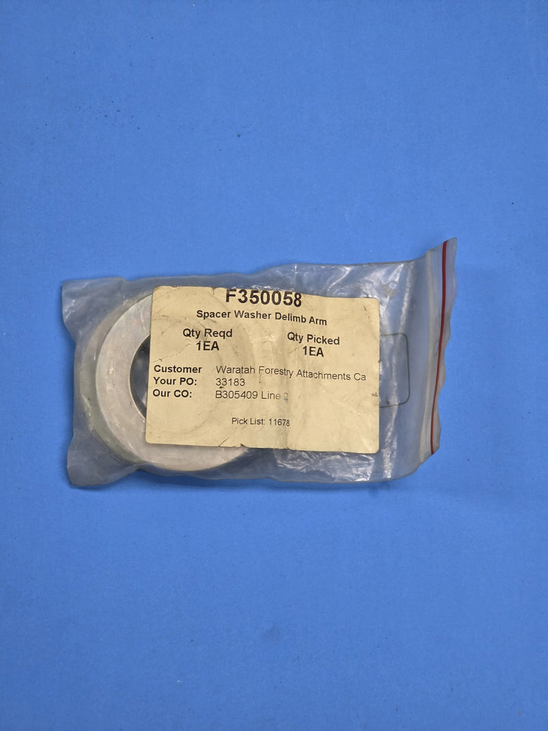 Waratah F350058 delimb arm spacer washer in its picked bag at AIM Rentals Prince George