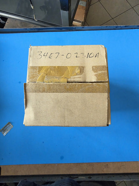 Plain kraft carton with the part number 34E7-02310A written on it by hand