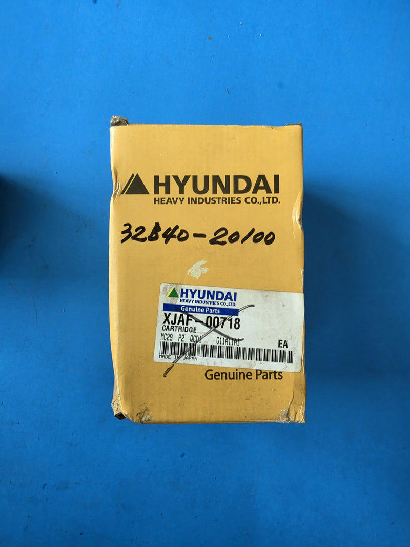 Hyundai Heavy Industries cartridge carton with the printed XJAF-00718 label crossed out and 32B40-20100 written on it by hand