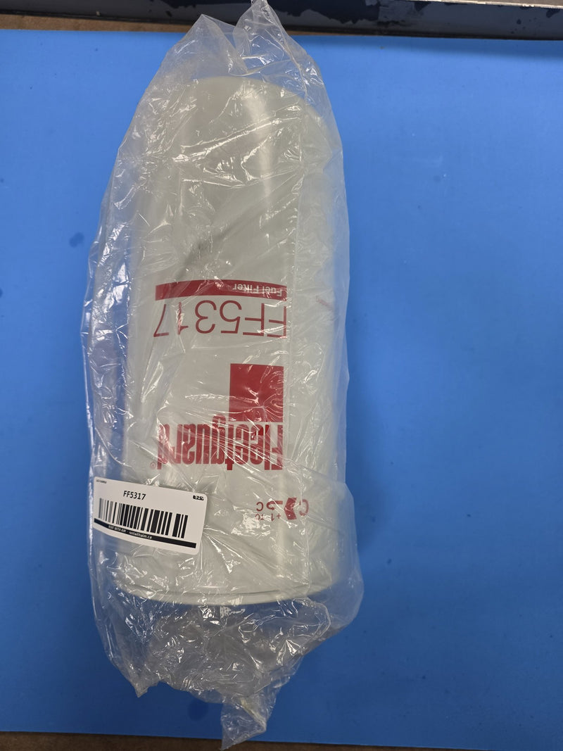 Fleetguard FF5317 fuel filter in the original bag with an AIM barcode label applied