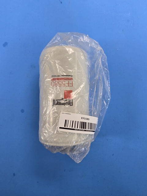 Genuine Fleetguard FF5580 fuel filter with Cummins 3973232 printed on the can, in the factory bag