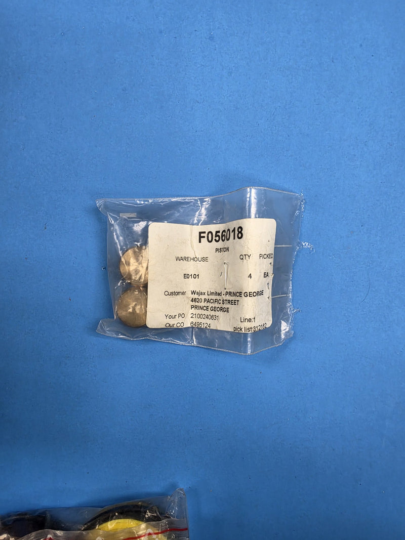 Pick ticket F056018 PISTON on a bag of brass pistons at AIM Rentals Prince George