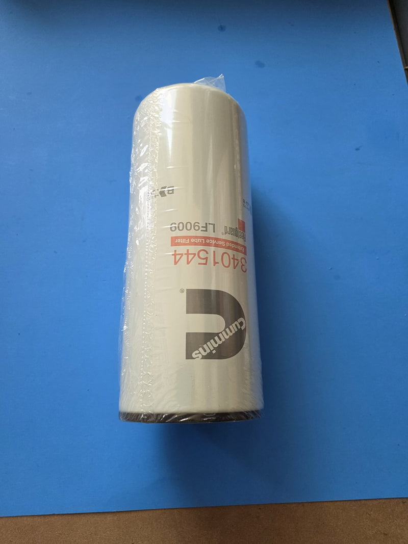 Genuine Fleetguard LF9009 extended service lube filter, shrink wrapped, Cummins 3401544 printed on the can, photographed in Prince George BC
