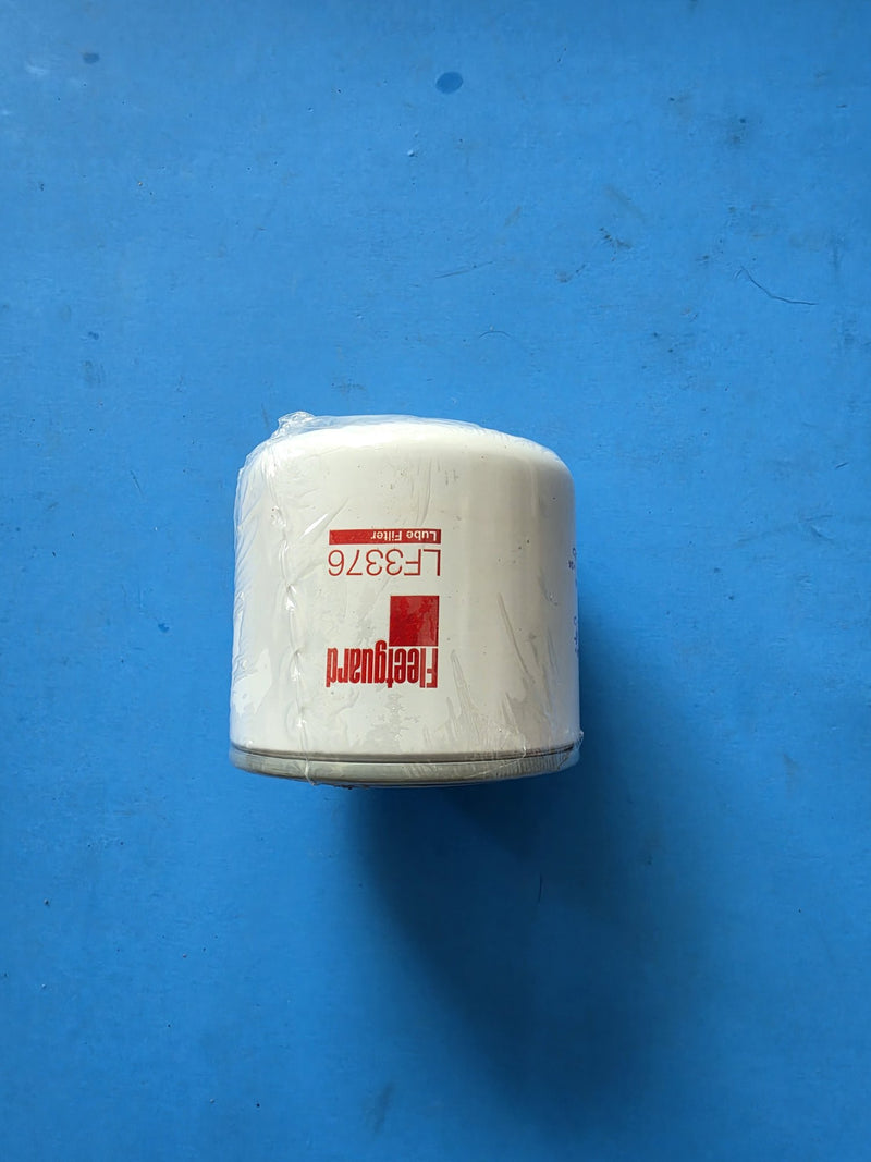 Genuine Fleetguard LF3376 lube filter, short shrink wrapped can, photographed on the bench in Prince George BC