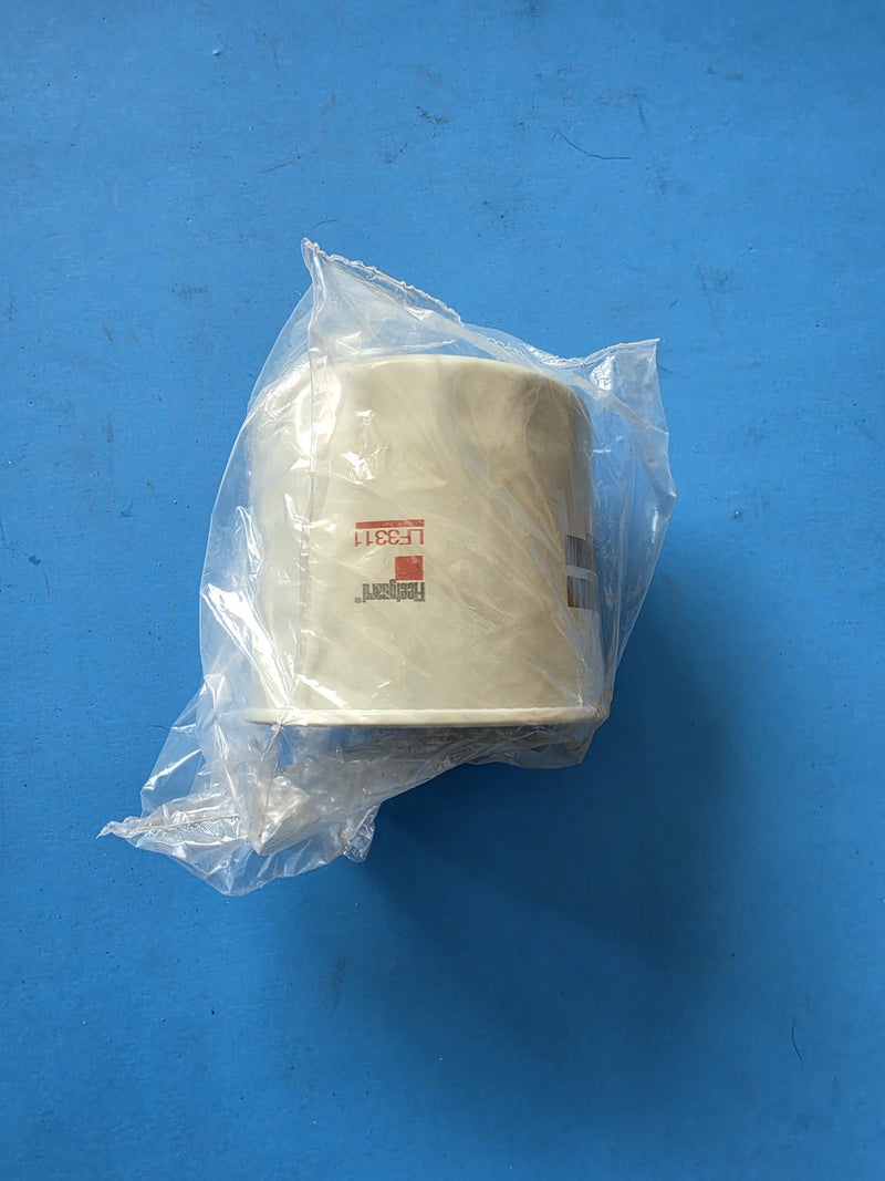 Genuine Fleetguard LF3311 lube filter bagged in clear poly with the barcode showing, photographed in Prince George BC