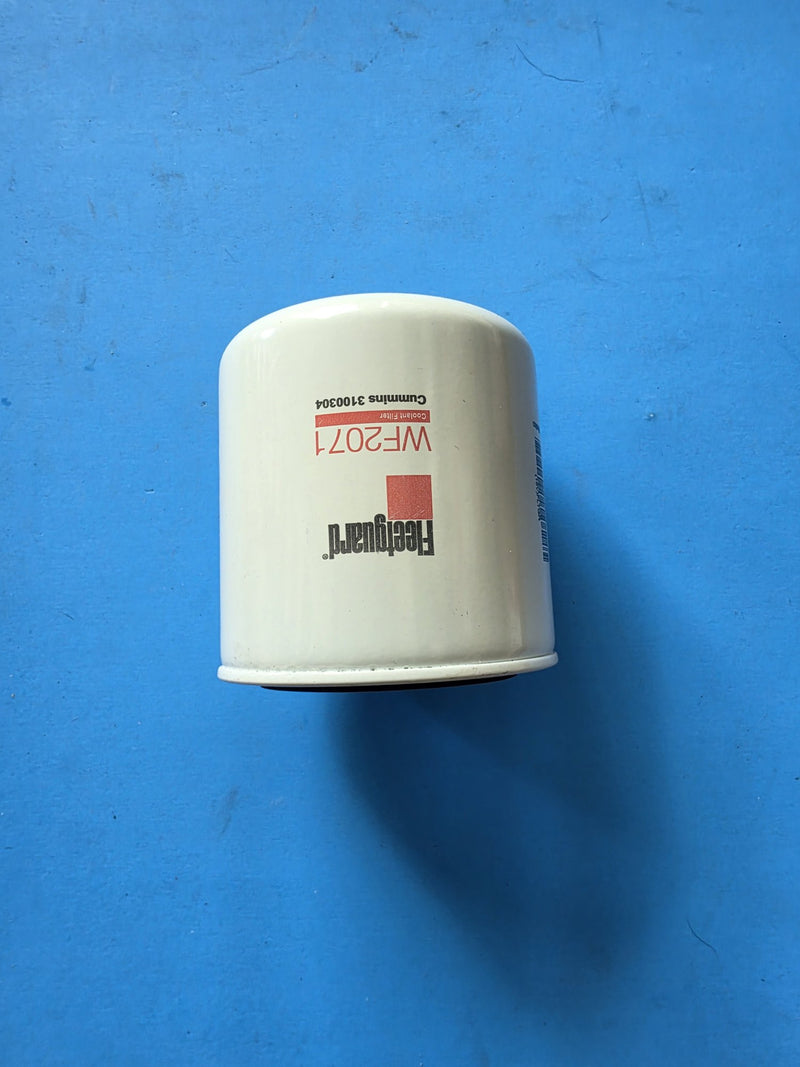 Genuine Fleetguard WF2071 coolant filter, short unwrapped can printed Cummins 3100304, photographed in Prince George BC