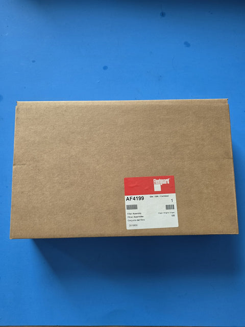 Genuine Fleetguard AF4199 filter assembly in a large flat factory box, label reading Filter Assembly with origin GB, photographed in Prince George BC