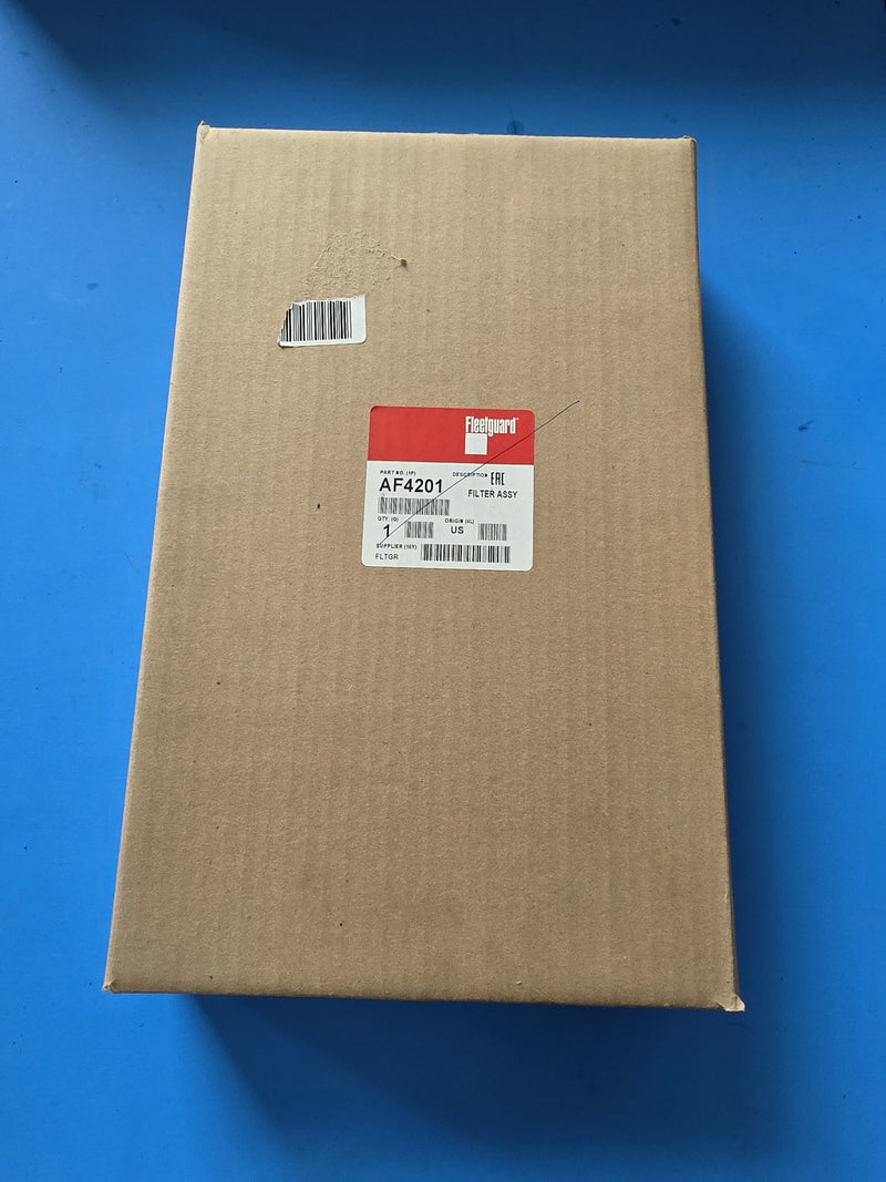 Genuine Fleetguard AF4201 filter assembly in a large factory box with the label struck through by a pen line, origin US, photographed in Prince George BC