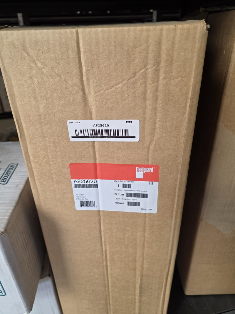 Genuine Fleetguard AF25620 air filter in a tall sealed carton with an AIM S4-E shelf sticker, origin France date code 22354, photographed in Prince George BC