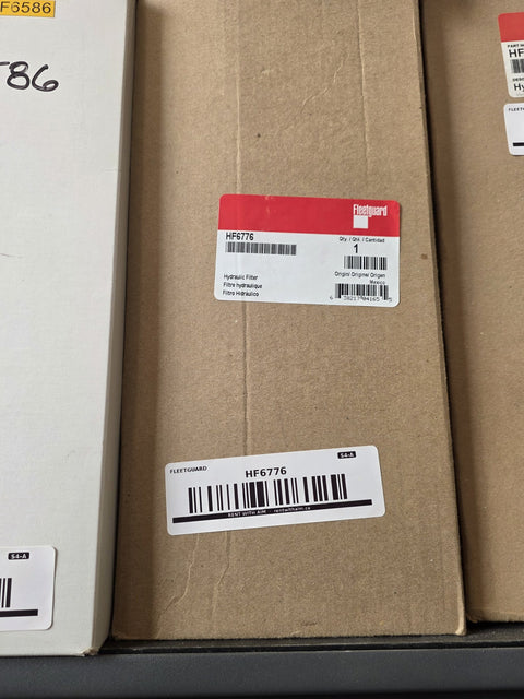 Genuine Fleetguard HF6776 hydraulic filter, factory red label reading Hydraulic Filter origin Mexico, AIM Fleetguard shelf barcode below, Prince George BC